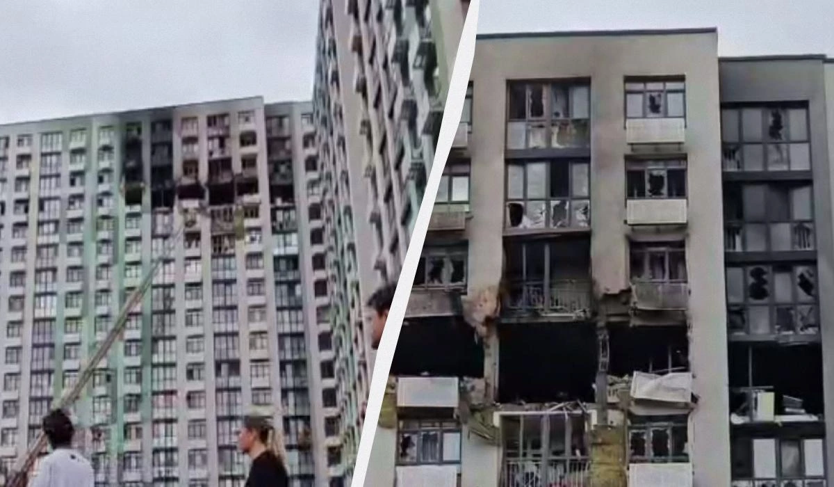 Росіяни вдарили по багатоповерхівці у Києві на Подолі: вигоріли верхні поверхи (відео)